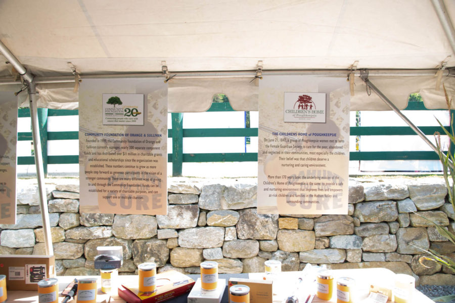 Tent display with supplement jars and posters