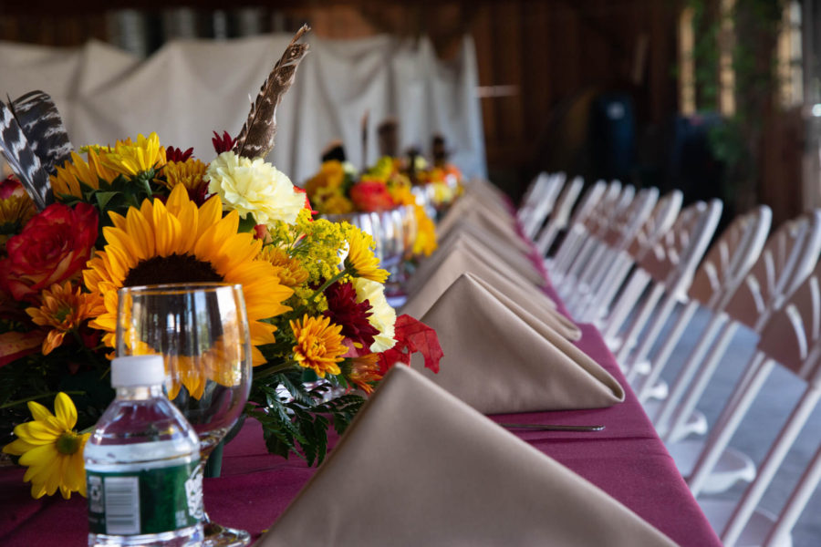 Long banquet table with sunflower centerpieces
