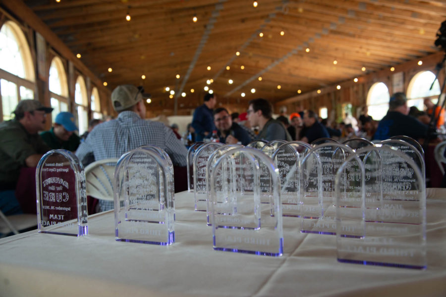 Clear acrylic awards displayed on a table