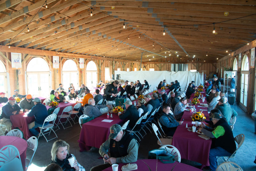 Community luncheon in rustic wooden event hall