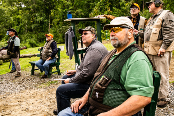 Group of shooters at outdoor shooting range