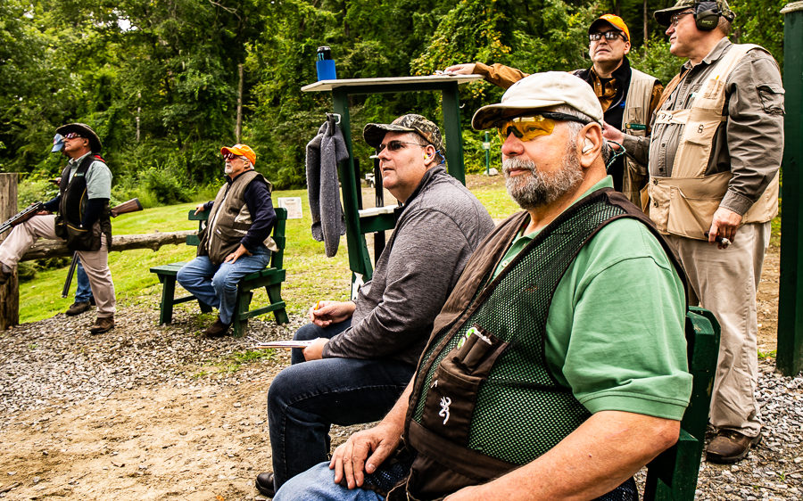 Group of shooters at outdoor shooting range