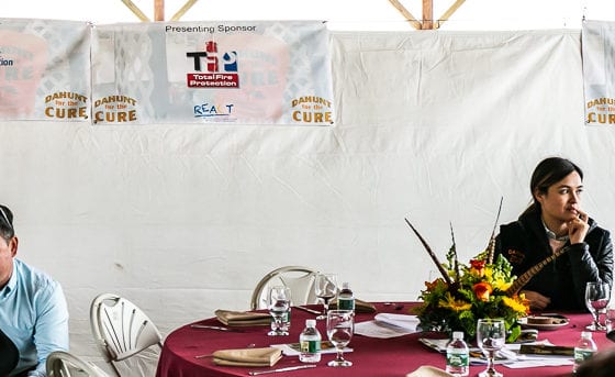 Attendees seated at banquet tables with centerpiece