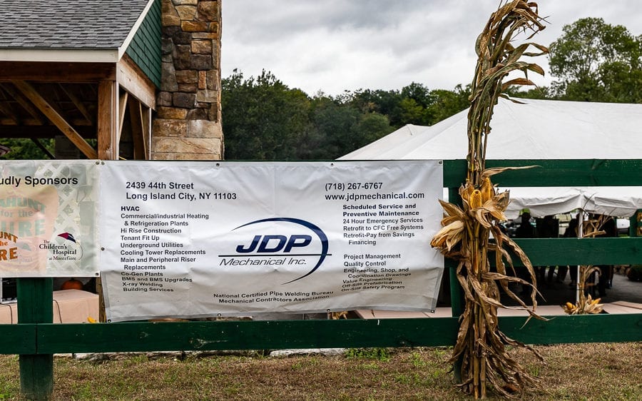 Sponsor banner on fence at outdoor event