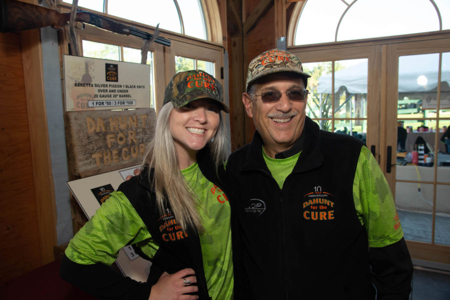 Two smiling participants in matching charity shirts