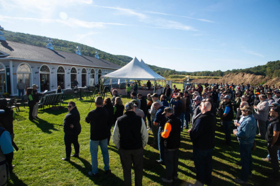 Large crowd at outdoor tented event
