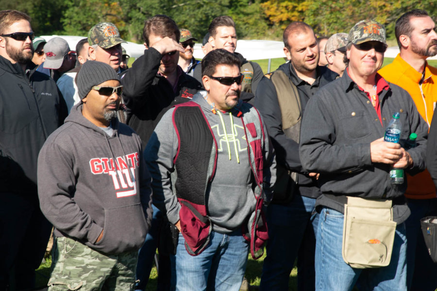 Men gathered outdoors at an event
