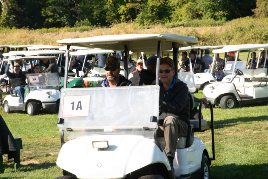 Golf carts with players lined up at tournament