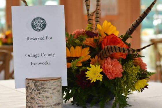 Reserved table sign with autumn floral centerpiece