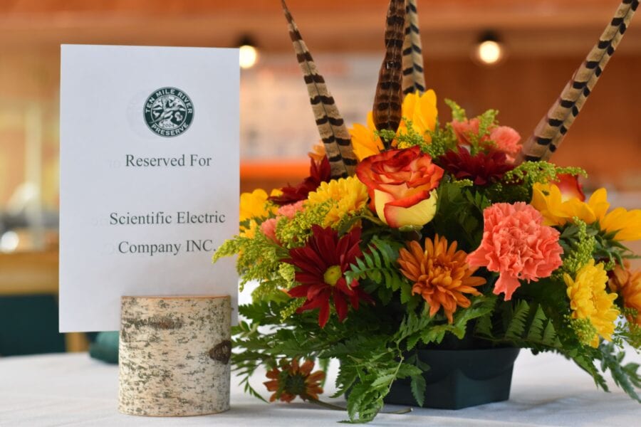 Reserved sign with colorful autumn floral centerpiece