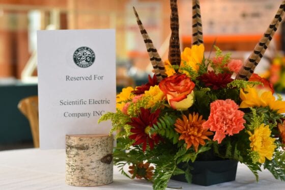 Reserved table sign with autumn floral centerpiece