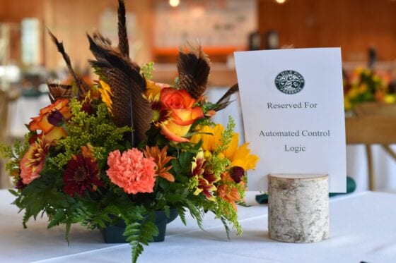 Floral centerpiece with Automated Control Logic sign