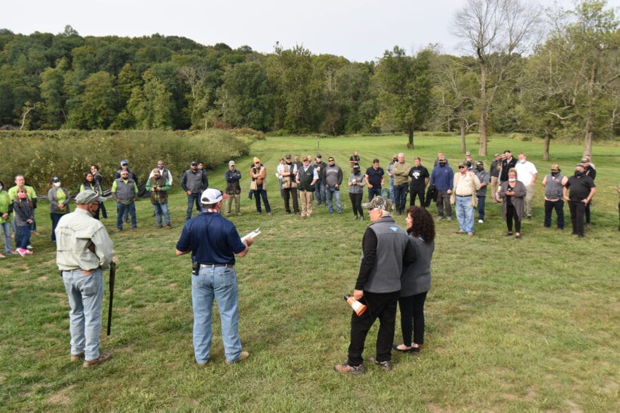 Large outdoor group meeting on grassy field