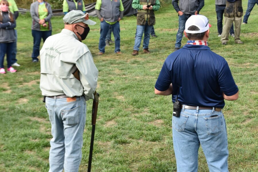 Outdoor shotgun safety briefing with instructors