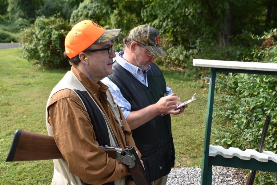 Two men at outdoor shooting range