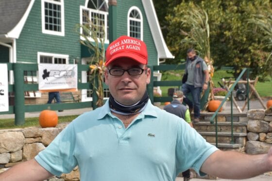 Person wearing red "Make America Great Again" hat
