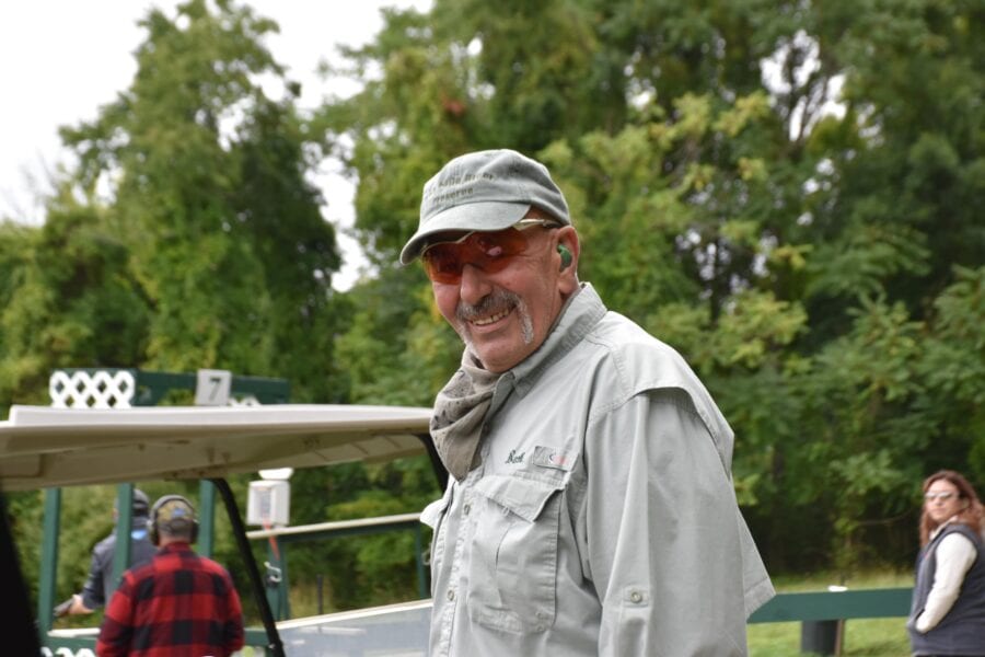 Smiling older man in cap and sunglasses