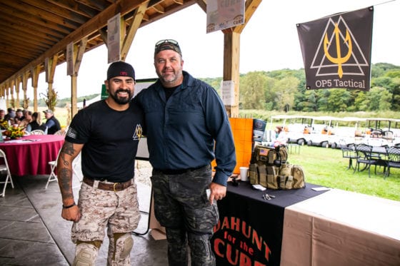 Two men smiling near OP5 Tactical booth