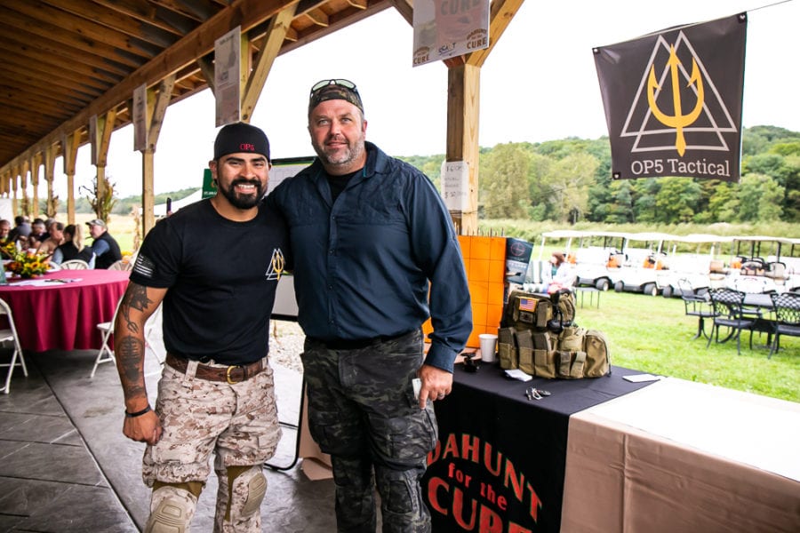 Two men smiling near OP5 Tactical booth