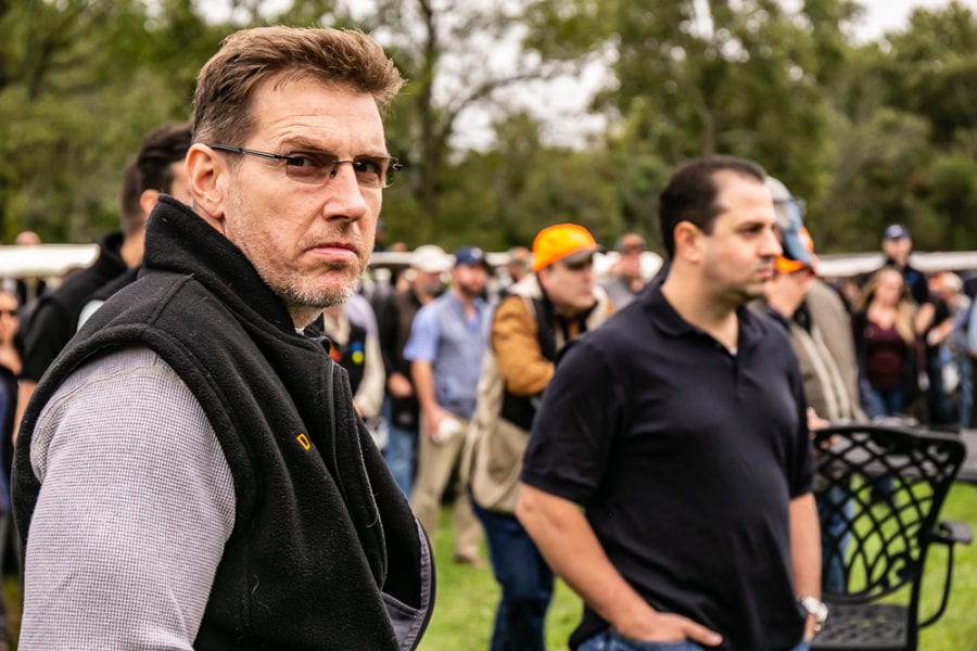 Serious man wearing glasses at outdoor event